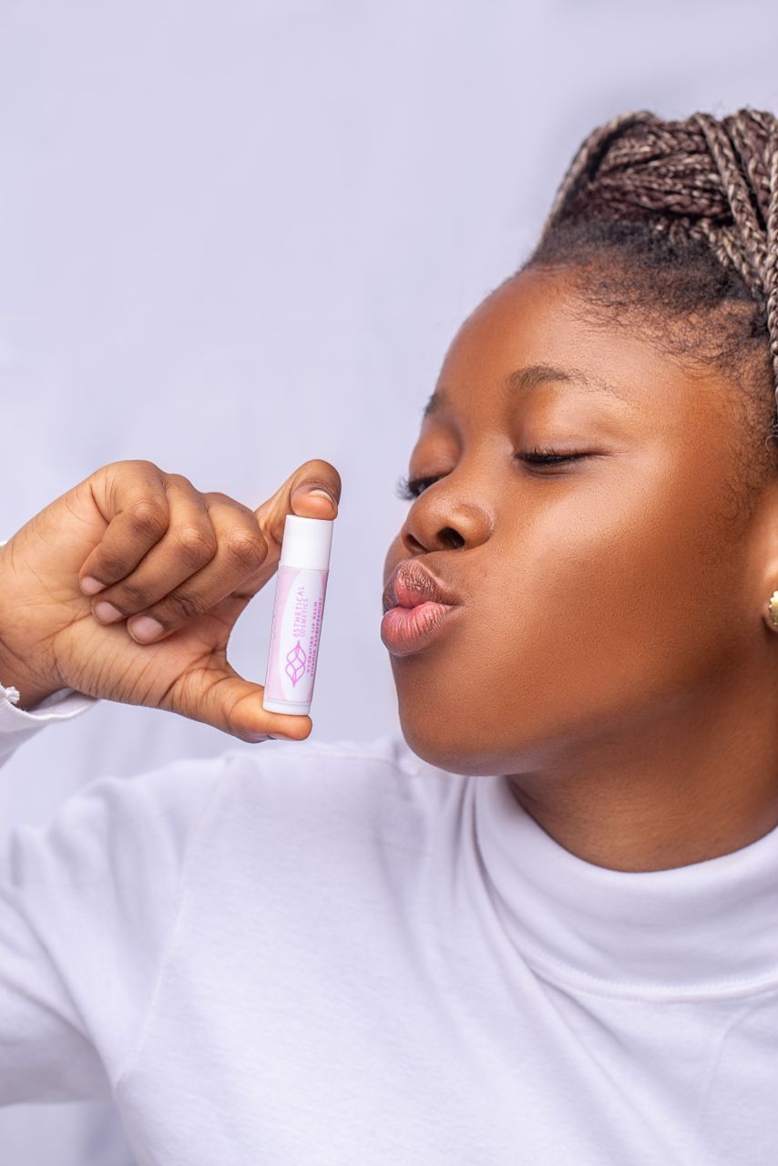 Lady holding Esthetical Lip Gloss